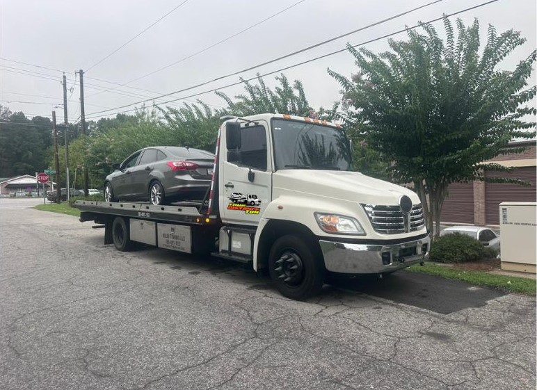 Towing service sedan Atlanta Georgia rainy day